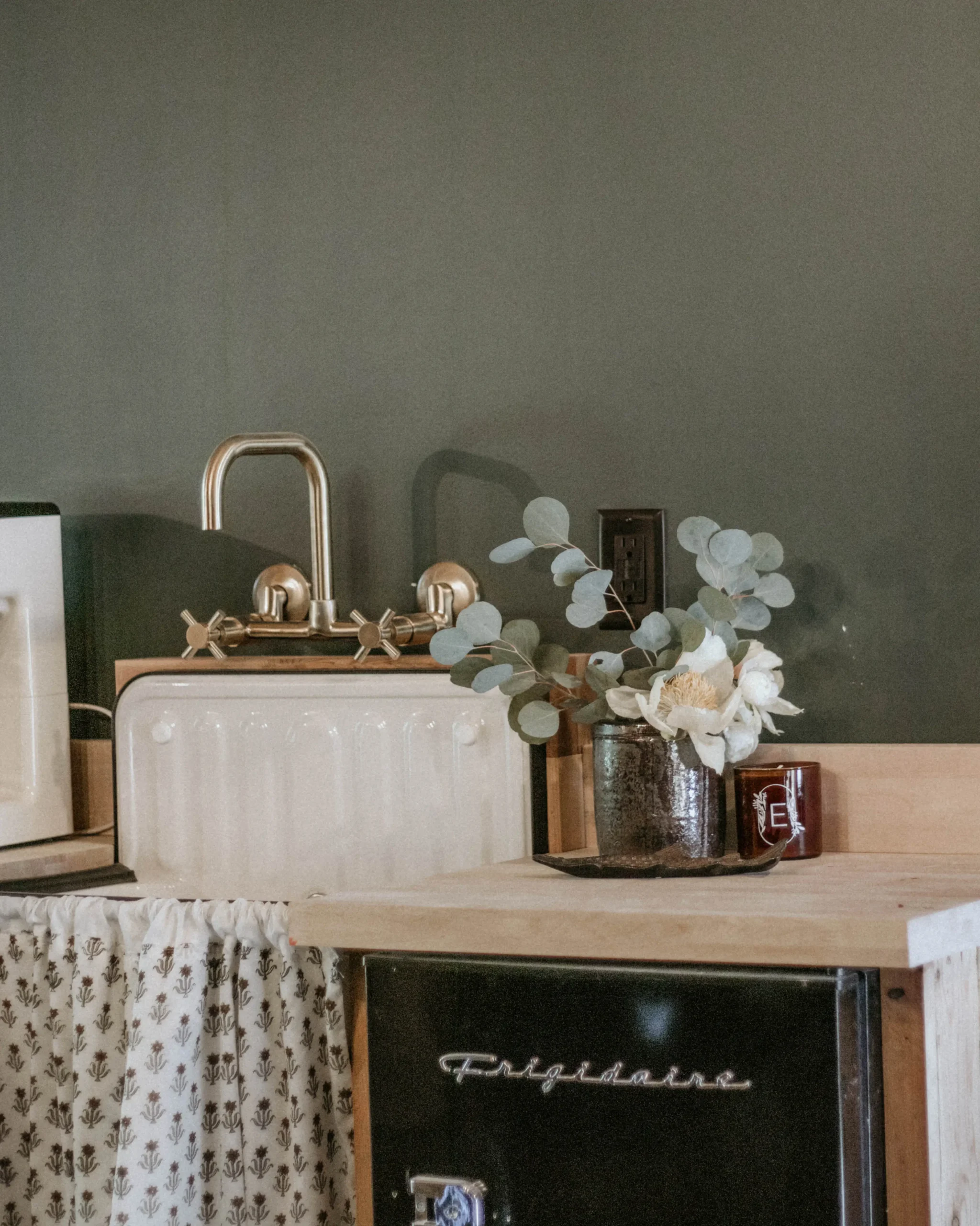 a vase of flowers sitting on top of a table