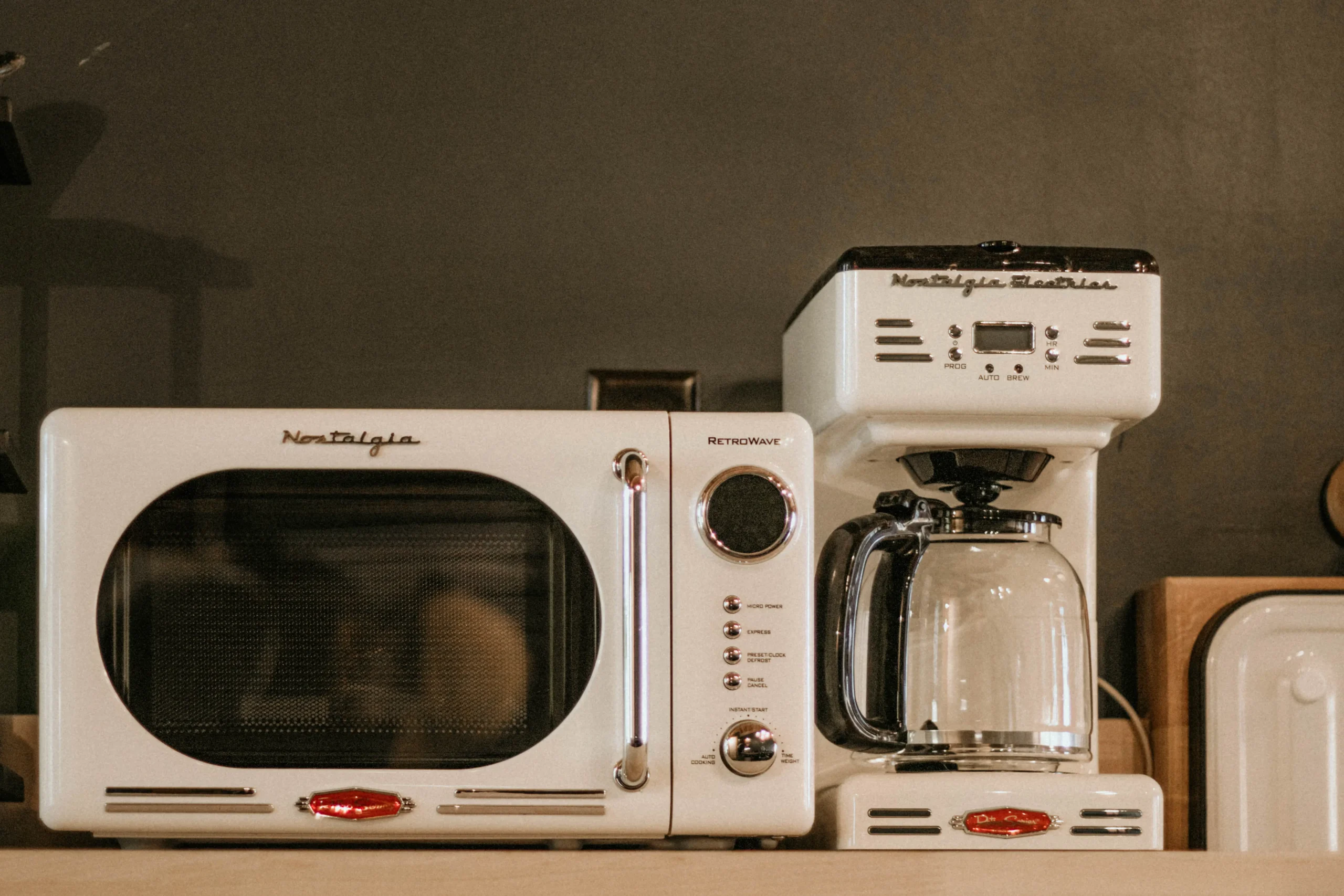 a white microwave oven sitting on top of a counter